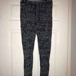 Ankle length, black and white patterned pants.
